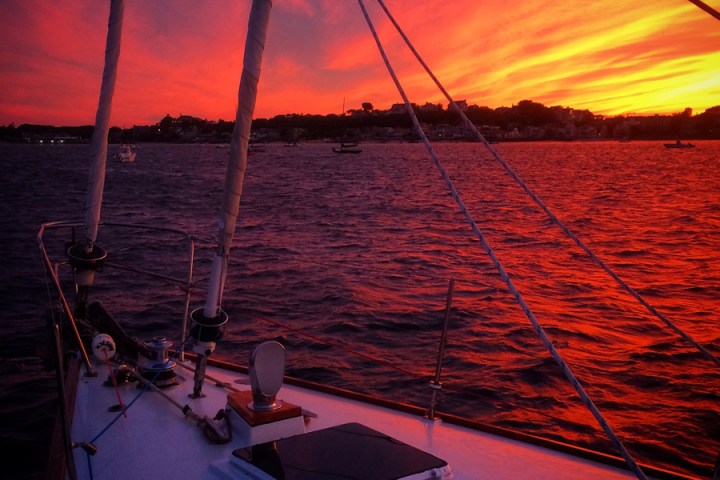 Sunset on the water from a sailboat