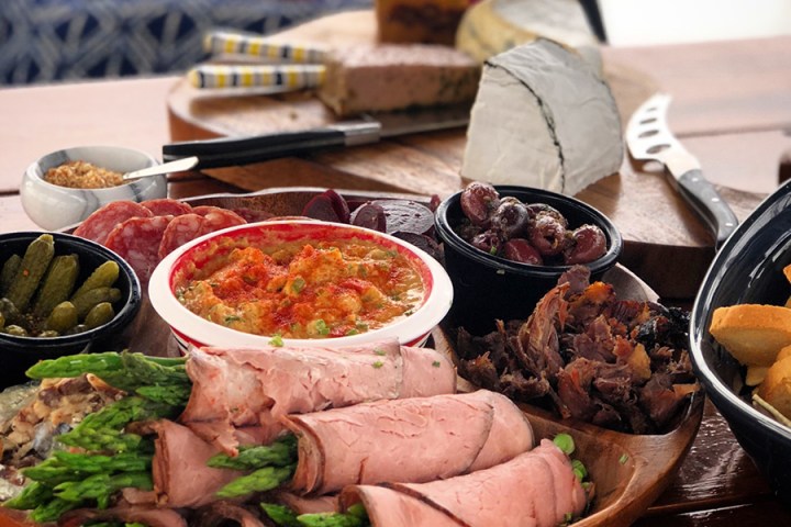 Up close photo of deli meats and light snacks set out on platter