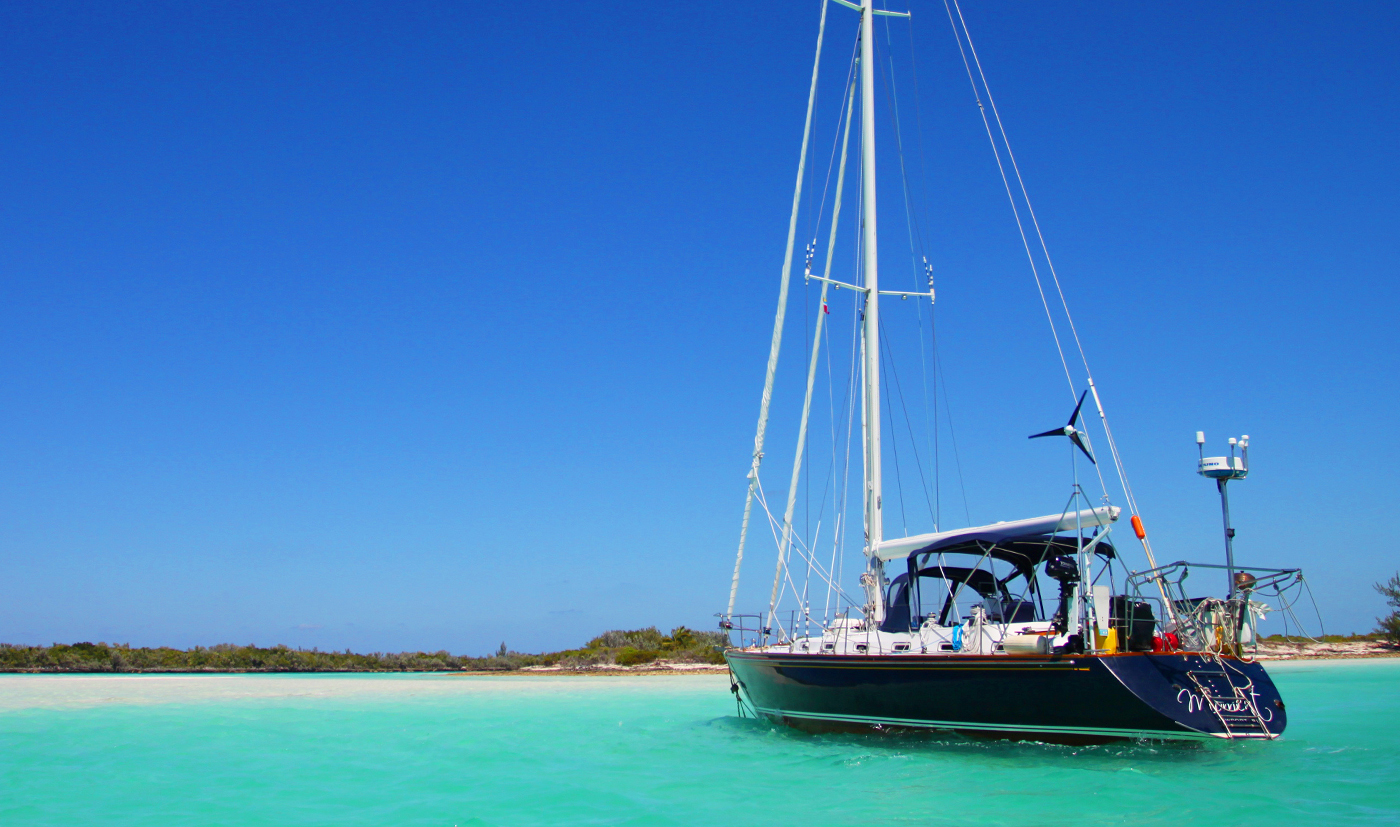 Sailboat anchored off island in the Caribbean